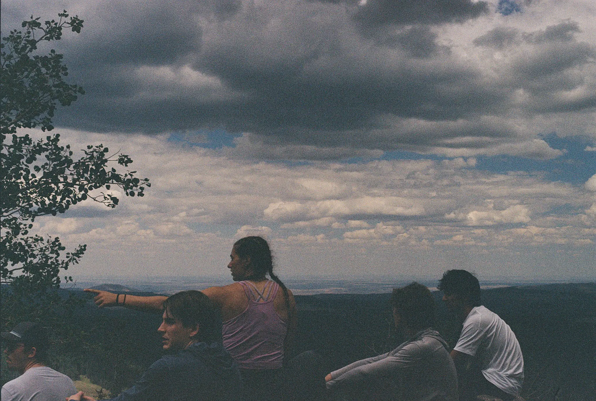 MCA members looking across the landscape beneath a dramatic sky